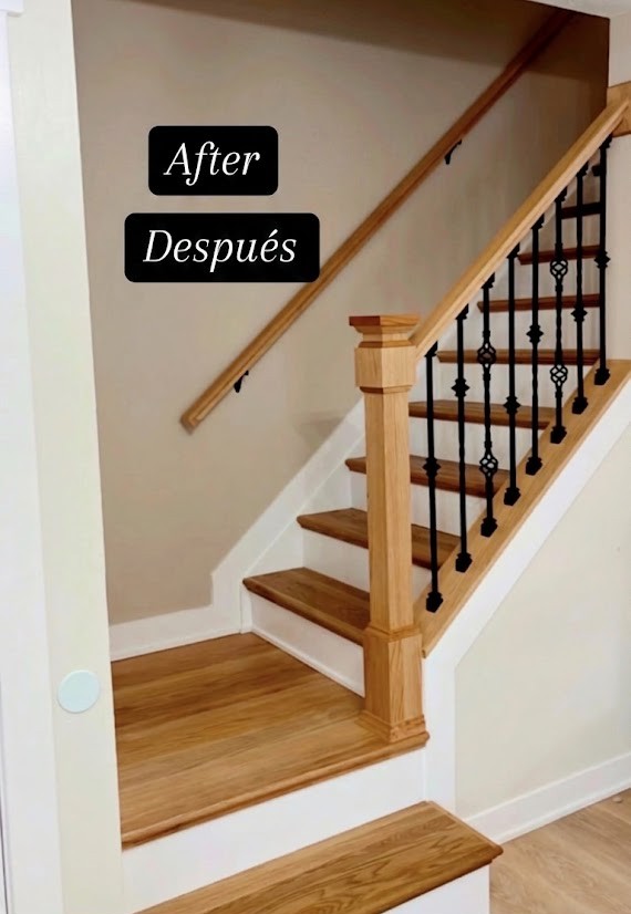 Staircase remodel — after, with oak treads and iron balusters